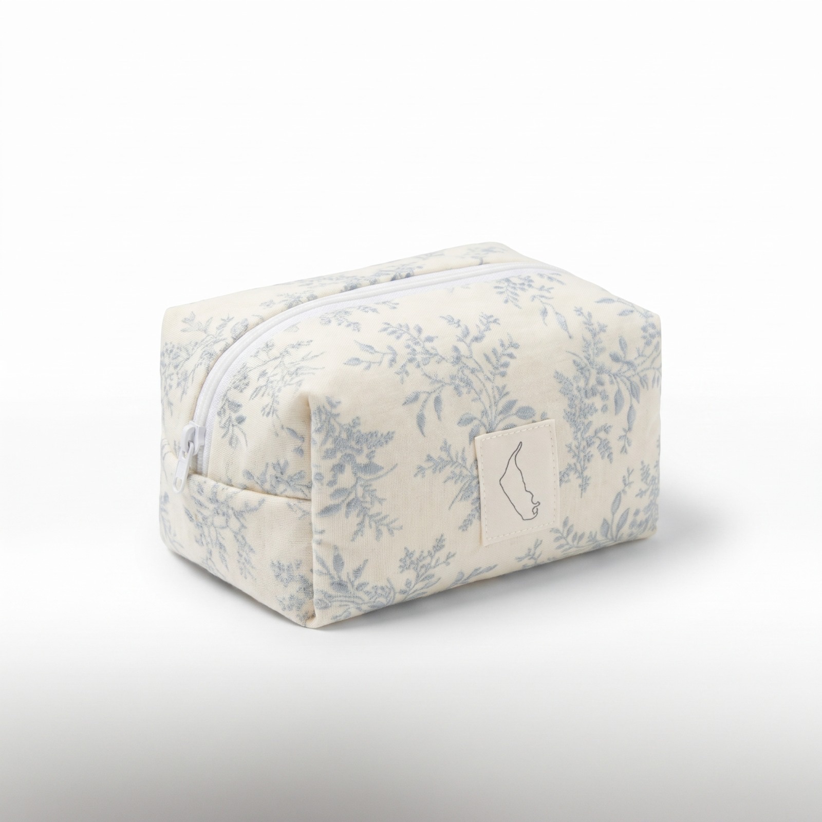 Kosmetiktasche aus cremefarbenem Stoff mit staubblauem Toile-Blumenmuster
